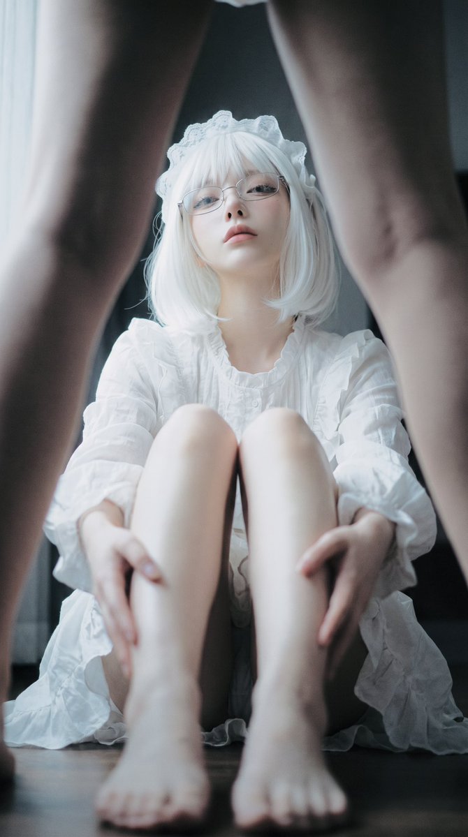 low angle portrait of white wavy hair woman in