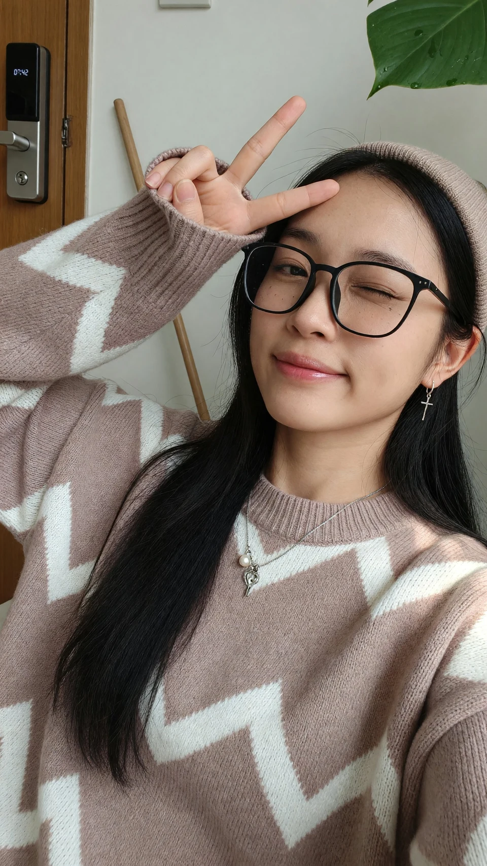Winking woman in glasses and sweater