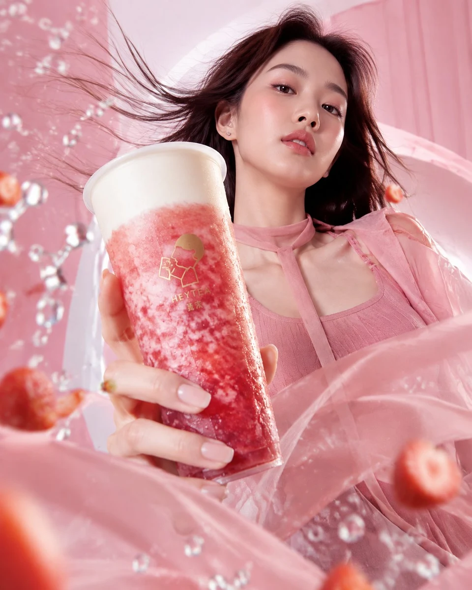 Asian woman holding strawberry drink in pink fashion