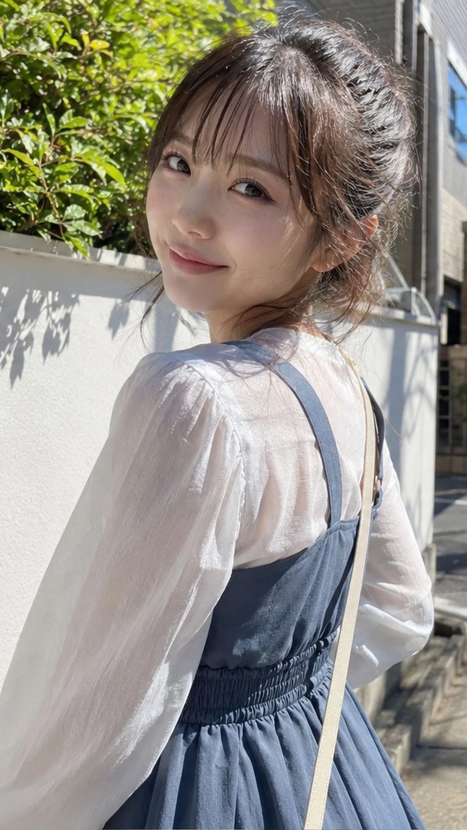 Japanese woman looking back over shoulder in sunny