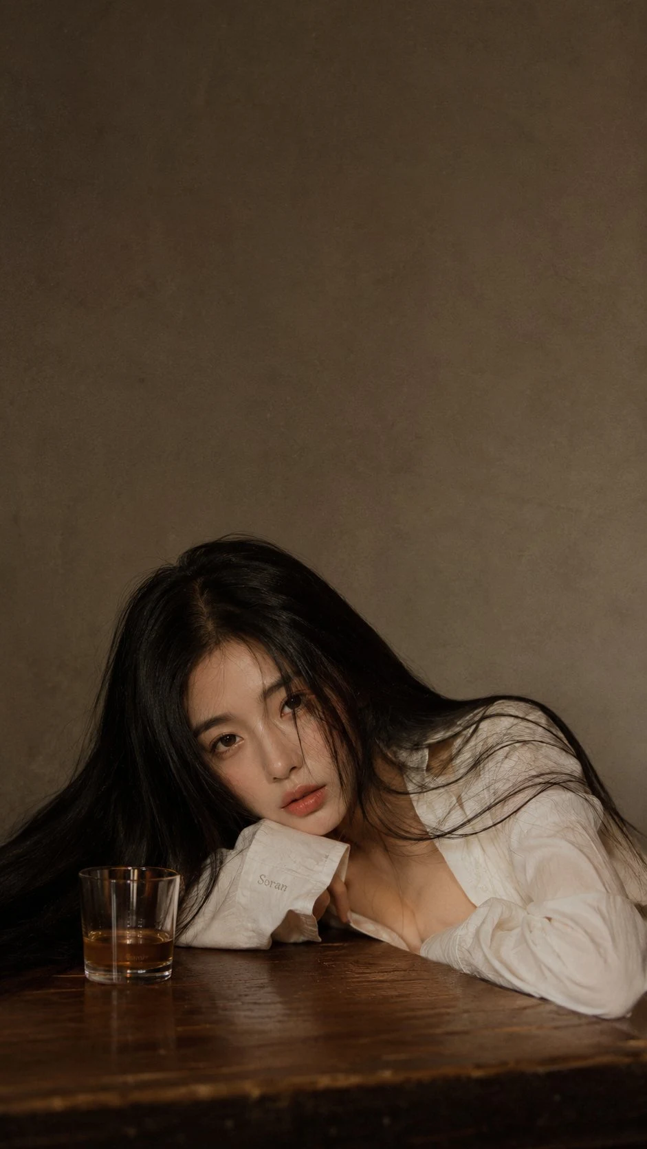 vintage film portrait of tired woman with black hair