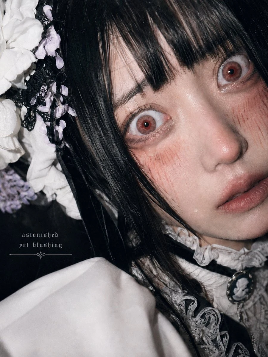 Close-up portrait of an astonished woman in gothic