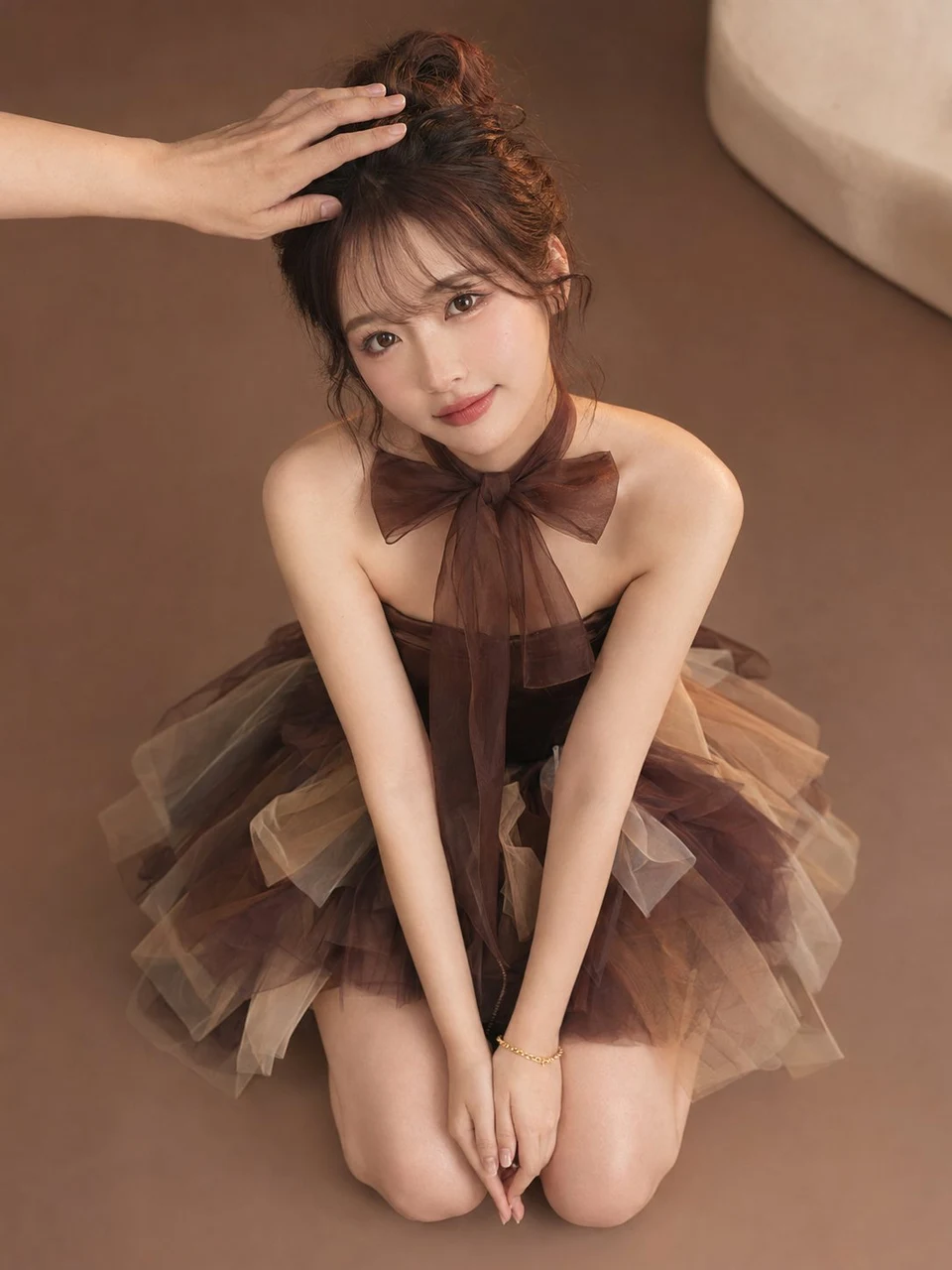 High-angle fashion portrait of young woman in tulle