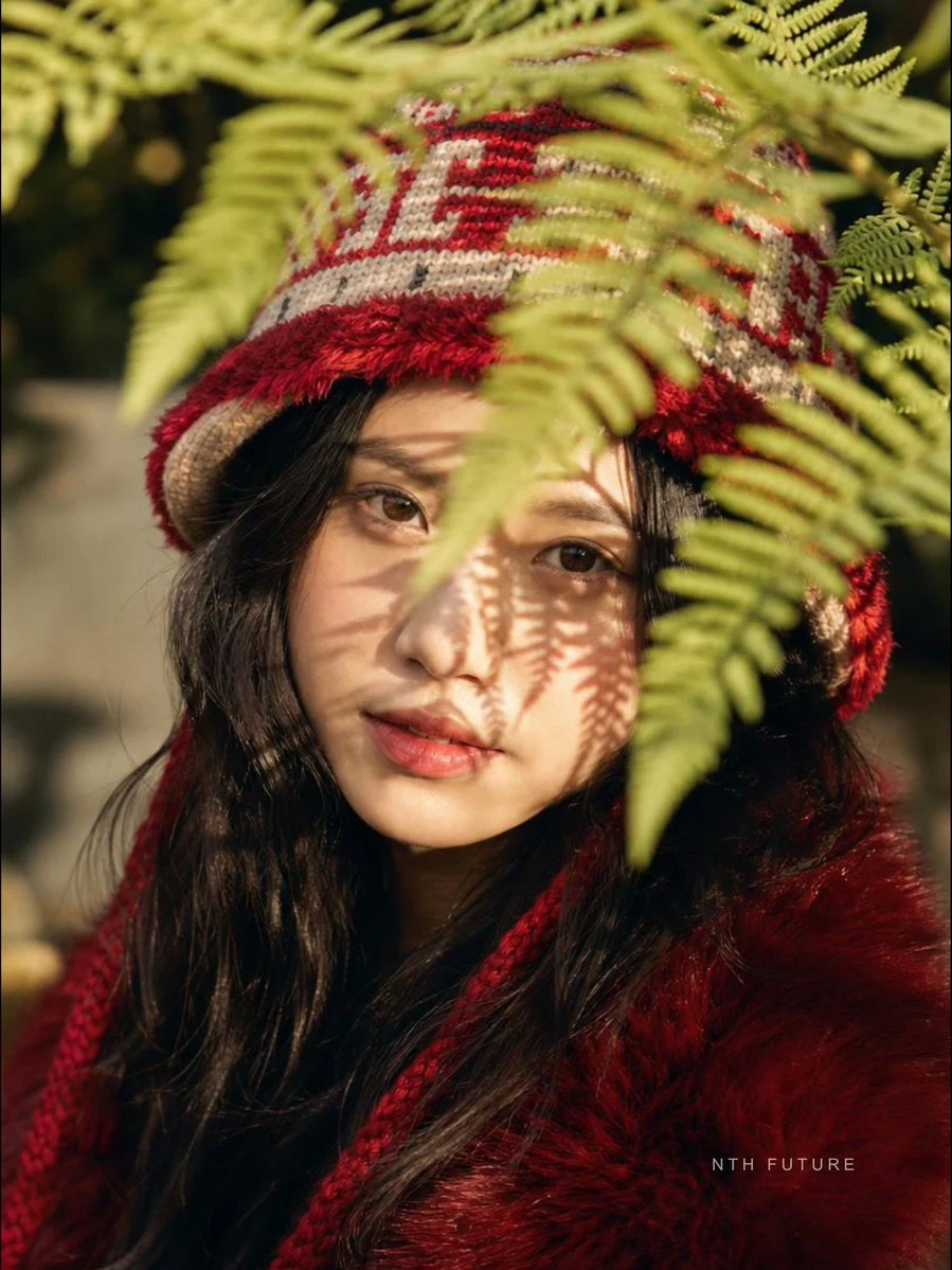 Vietnamese model red knit hat and fur coat portrait