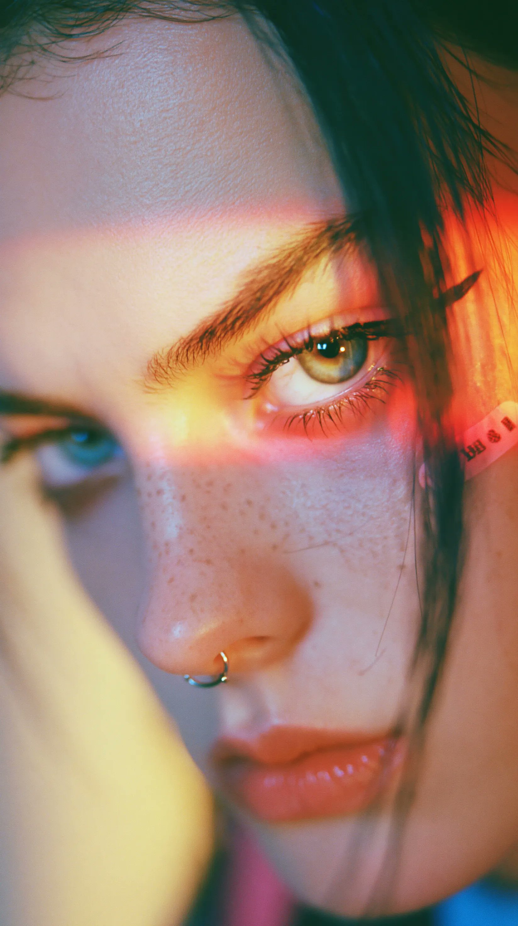 colorful neon portrait of a woman with heterochromia