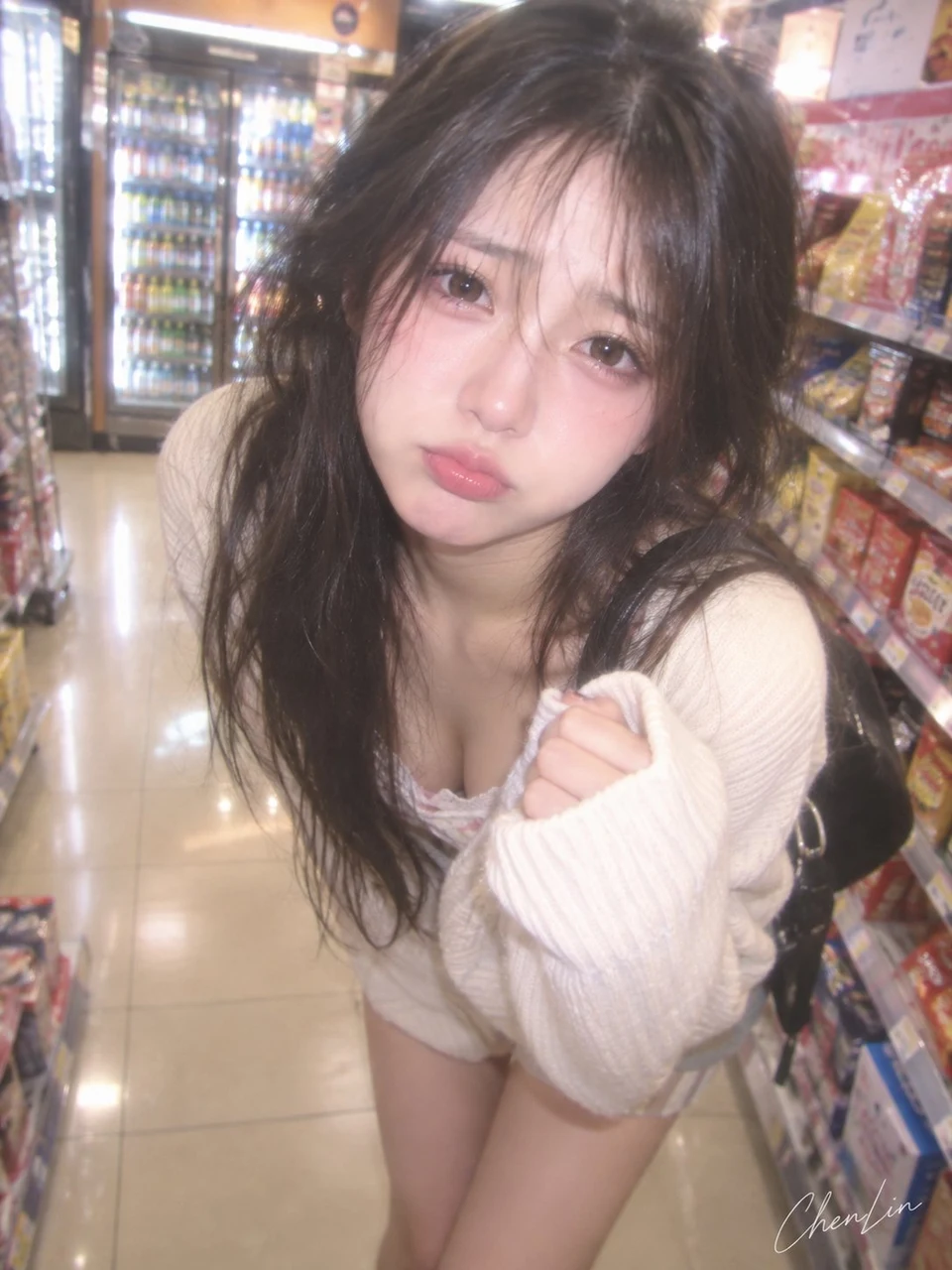 young woman in convenience store with soft flash