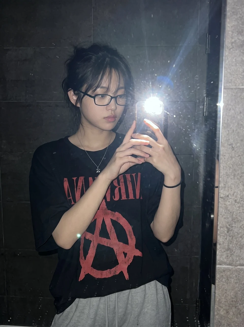 Candid Young Woman Taking Mirror Selfie With Direct