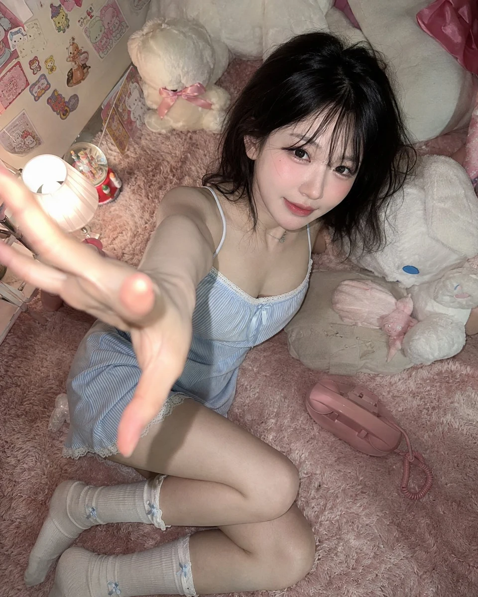 Young woman on pink carpet with hand reaching to