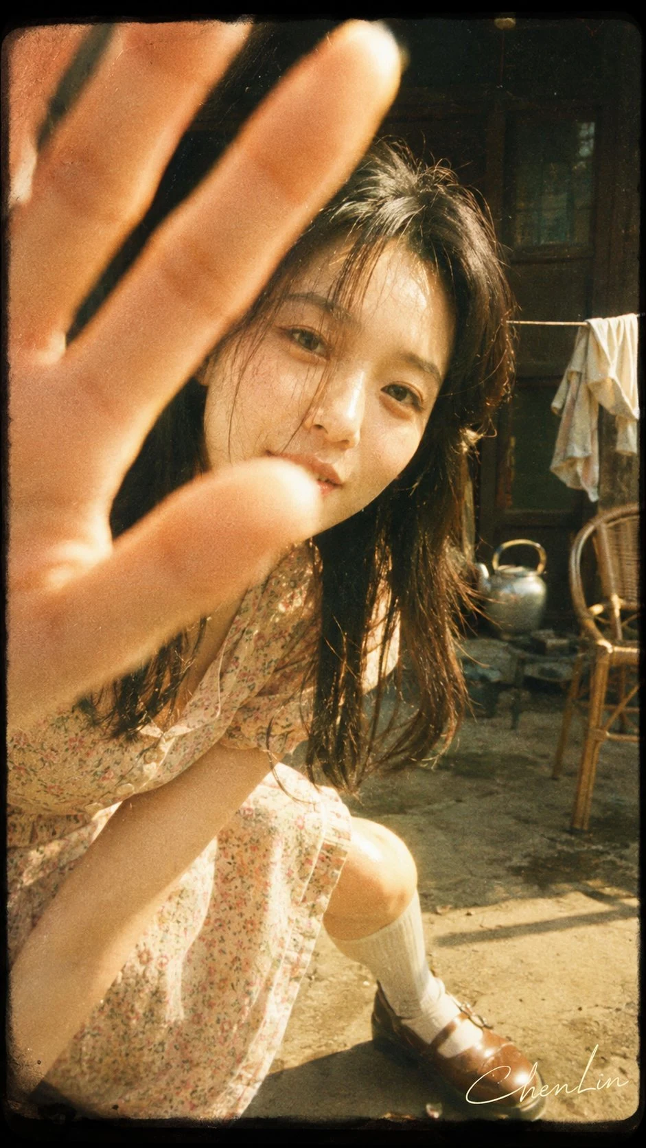Vintage super 8 film portrait of young woman holding
